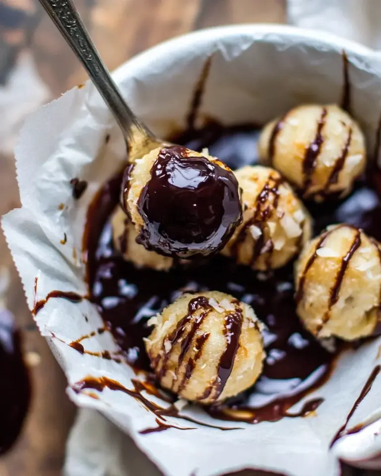Delicious Sweet Cuban Coconut Balls with Melted Chocolate (Coquito Acaramelado). recipe photo