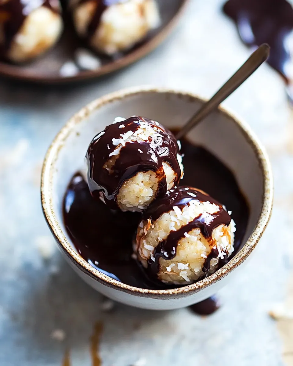 Delicious Sweet Cuban Coconut Balls with Melted Chocolate (Coquito Acaramelado). recipe image